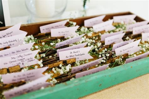 Wedding place cards a way to help guests find their seats at the reception. DIY Clothespin Place Card Holders for a Rustic Vintage Wedding - the thinking closet