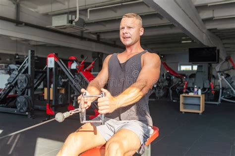 Muscular Man Working Out In Gym Doing Exercisesexercise For Triceps In