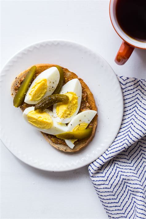 Eating eggs for breakfast will not only help keep you fuller for longer, they are a great source of protein and vitamin a which helps improve skin quality. hard boiled egg toast