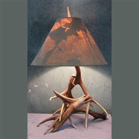 Check out our deer antler lamp selection for the very best in unique or custom, handmade pieces from our table lamps shops. Folk Art Eagle Antler Table Lamp