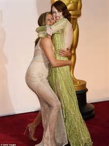 Emma Stone And Jennifer Aniston Hug It Out On Academy Awards Red Carpet