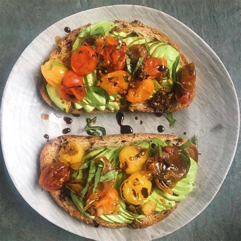 Fancy Avo Toast For Breakfast Avo Topped With Pan Cooked Heirloom