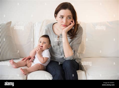 Mother With New Baby Suffering From Postpartum Depression Stock Photo