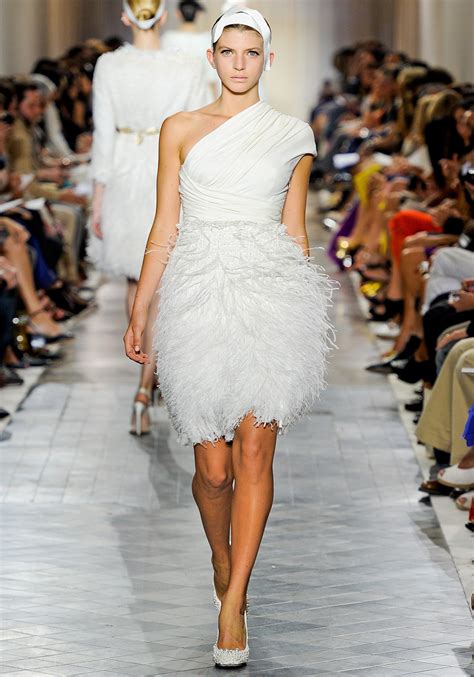 However, black is less universal than white. One-shoulder feather embellished little white wedding ...