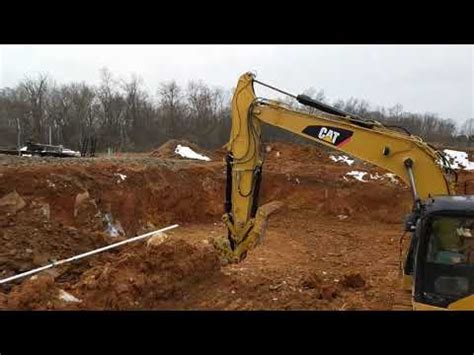 If your house is elevated above the digging site, your excavator may dig a single entryway into the basement area, and then use a skid loader to scoop out and remove the soil under your house. House basement excavation - YouTube