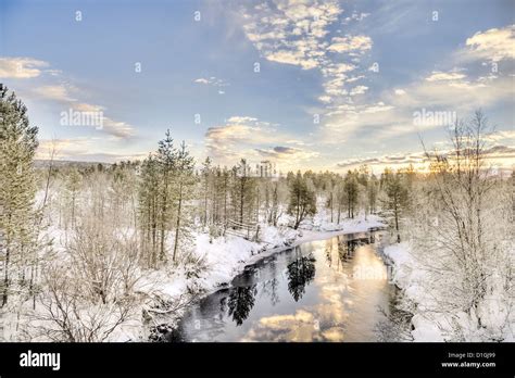Lake Flowing In The Frozen Landscape In Inari Lapland Finland Stock