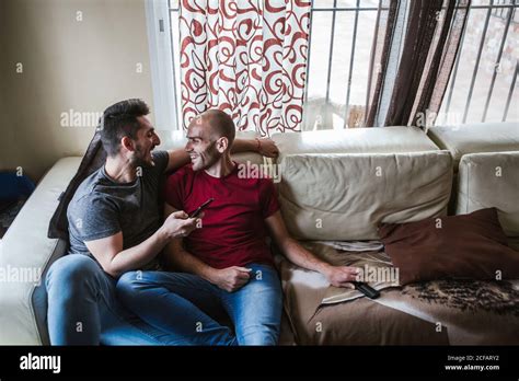 Gay Couple Relaxes On The Couch Stock Photo Alamy