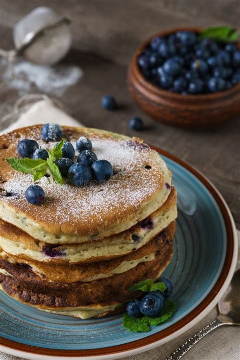 Pancakes With Blueberries Mint And Powdered Sugar Stock Photo Image