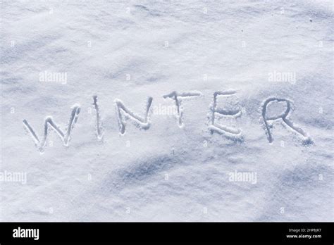 Winter Word Written In The Snow Stock Photo Alamy