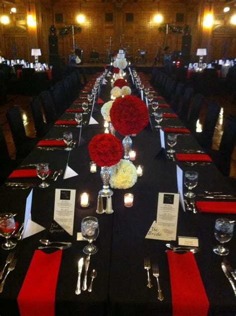 Red Satin Napkins Accent The Black Table Linens And Black Chair Covers