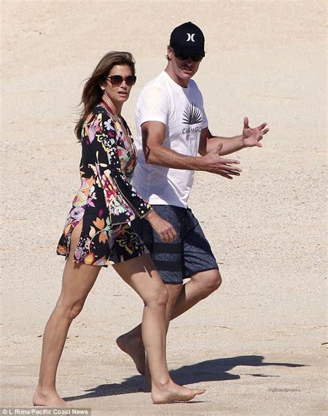 Cindy Crawford Shows Off Her Long Lean Legs As She Enjoys A Beach Walk