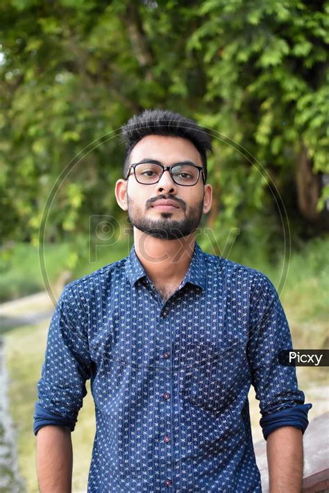 Image Of Portrait Of A Young And Handsome Indian Bengali Man Standing In Front Of A Vintage