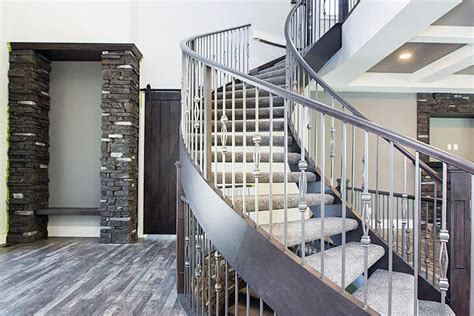 Curved Staircase Around Stone Feature Wall Artistic Stairs And Railings