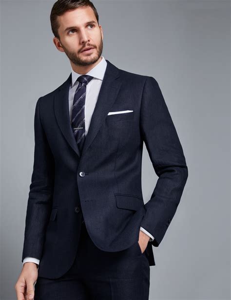 Excess fabric can make a man look slumped and saggy, while fabric that clings or pinches too tightly makes him look. Men's Navy Herringbone Tailored Fit Linen Italian Suit ...