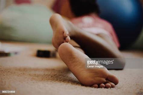 Girl Lying Barefoot Bildbanksfoton Och Bilder Getty Images
