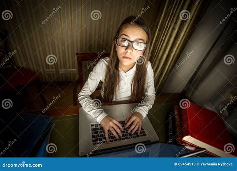 Portrait Of Computer Geek Girl Sitting At Laptop At Night Stock Image