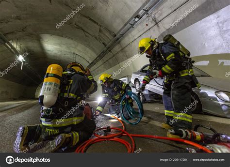 Car Accident Scene Inside A Tunnel Firefighters Rescuing People From