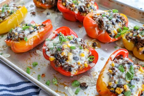 spicy mexican stuffed bell peppers barefeet in the kitchen