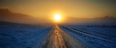 Download Wallpaper 2560x1080 Road Winter Snow Sunset Horizon Dual