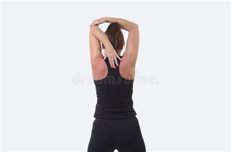 Attractive Middle Aged Woman In Sports Gear Warming Up With Shoulder