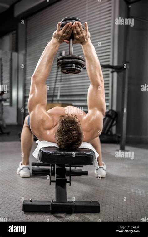 Shirtless Man Lifting Heavy Dumbbell On Bench Stock Photo Alamy