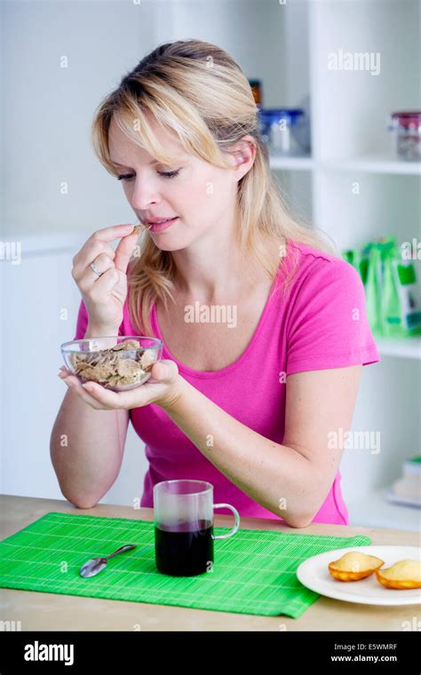 Woman Eating Breakfast Stock Photo Alamy