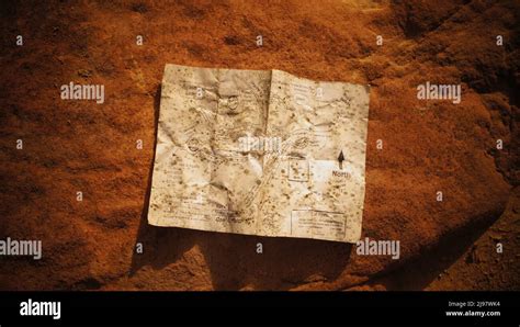 Ancient Treasure Map Lies On The Ground Stock Photo Alamy