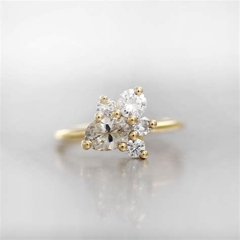 This Cluster Engagement Rings Showcases A Variety Of Different Shaped