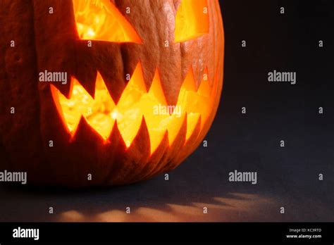 Photo Of An Angry Pumpkin Illuminated By A Candle Inside Stock Photo