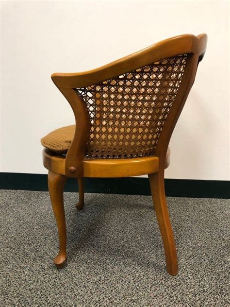 This classic wooden chair dates back to the middle ages, and quickly became a luxury piece when furniture designers began crafting them out of walnut. Vintage Wooden Chair With Caned Seat | Wooden chair, Chair, Upholstered chairs