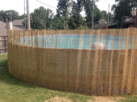 The fence must be a minimum of 48 inches tall the middle horizontal rail must be at least 45 inches above the bottom horizontal rail the spacing between pickets must be less than 4 inches. Add reed fence around above ground pool. (With images ...