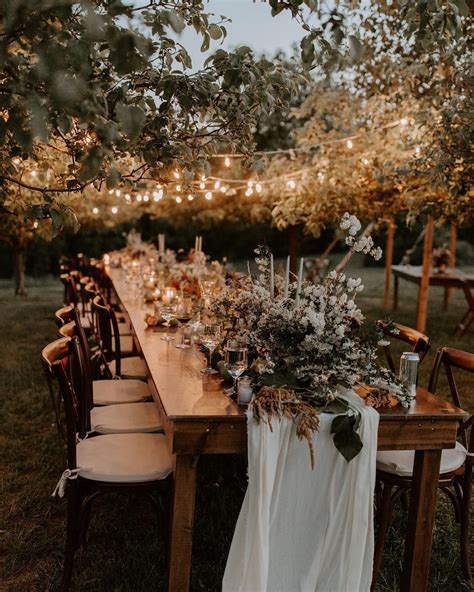 a rustic outdoor wedding reception in stowe vermont click to see wedding floral details