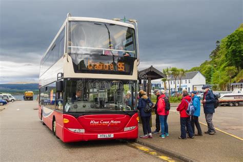 Passengers Embarking On The Craignure Bus At Tobermory On The Isle Of