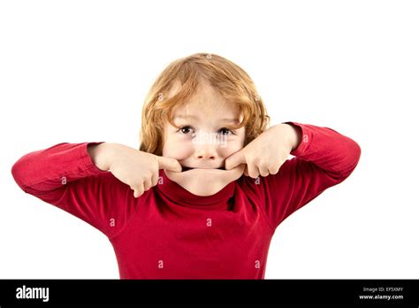 Silly Child Pulling Face Isolated Stock Photo Alamy