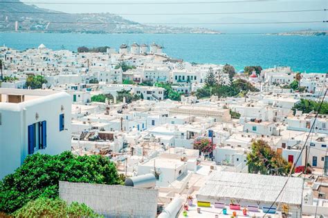 View Of Traditional Greek Village With White Houses On Mykonos Island