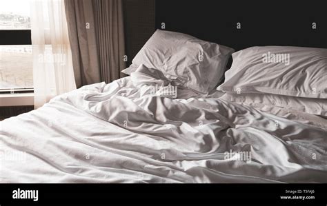 Rumpled Bed Sheets In The Morning Stock Photo Alamy