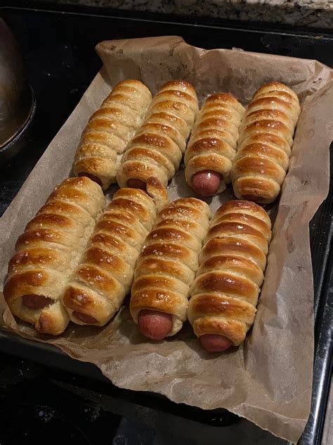 Return to the prepared cookie sheet, brush the top of each pretzel with the beaten egg yolk and water mixture and sprinkle with the pretzel salt. Pretzel Dogs