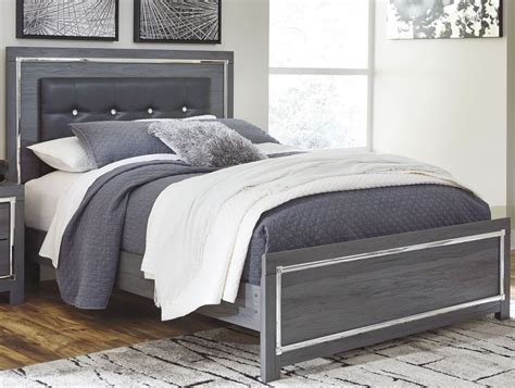 I got started building the bed frame. Lodanna Gray Queen Upholstered Panel Bed from Ashley | Coleman Furniture