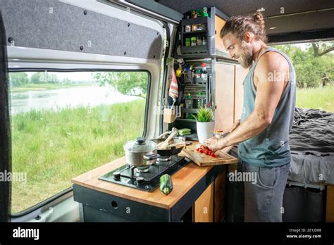 Young Man Living In A Camper Van Stock Photo Alamy