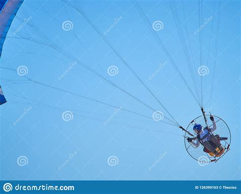Powered Paraglide Or Paramotor Against Blue Sky Paragliding Editorial