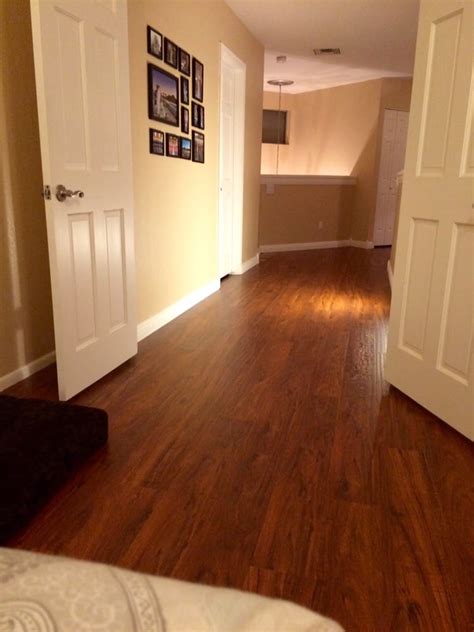 For example, if you have hardwood floors in your living space and a concrete floor in your basement, carpeted stairs might look quite out of place. New Brazilian Cherry Wood Laminate in our upstairs bedroom ...