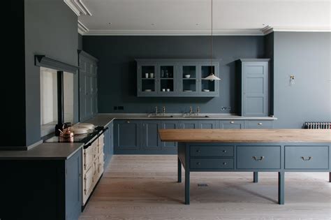 Dark Blue Kitchen With Centre Table Work Surface And Aga Plain
