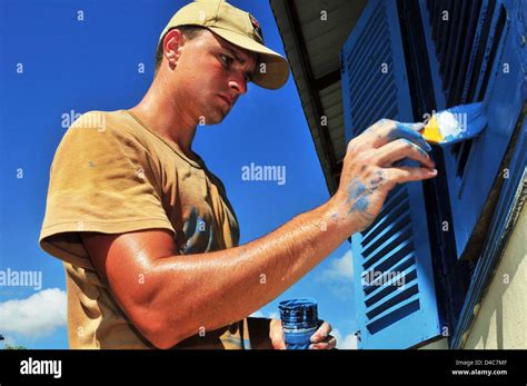 Australian Army Combat Engineer Sapper Tim Kesby Paints Window Shutters