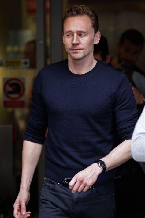 His hair color is brown and his eye color is hazel gray. Tom Hiddleston arrives at BBC Radio 2 studios in London on ...