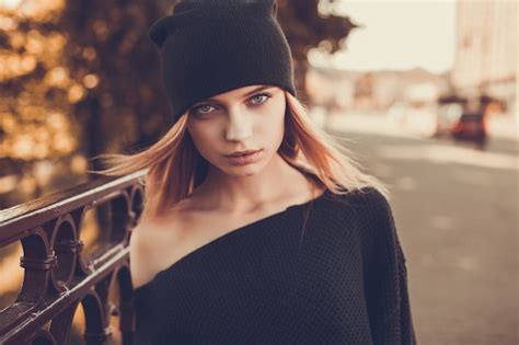 premium photo serious girl with a black cap