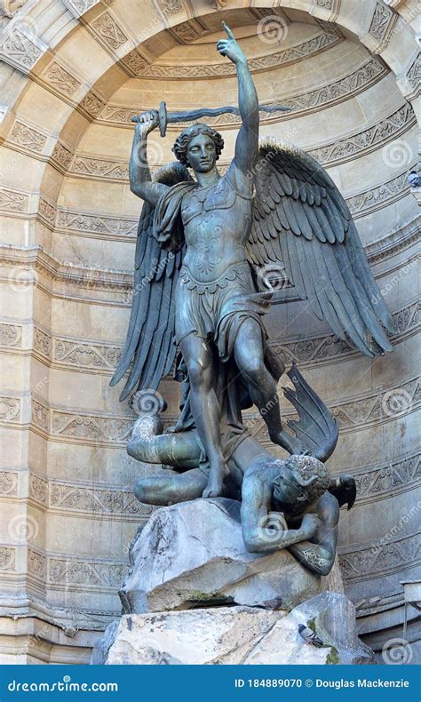 Statue Of The Archangel Michael And Lucifer At The Basilica Sacre Coeur