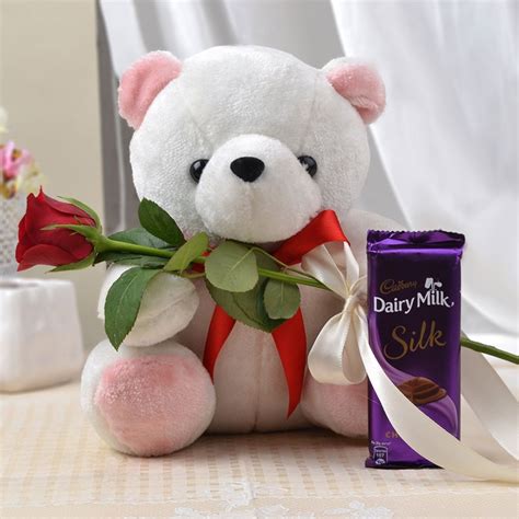 Send cadbury celebrations chocolate 141.5 gm with beautiful 10 pink rose, teddy bear 6 inches, pink jute wrapping online from wishbygift. Teddy Bear with Red Rose and Chocolate