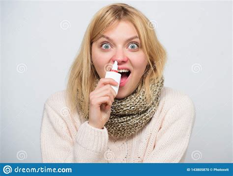 Seasonal Allergy Cute Woman Nursing Nasal Cold Or Allergy Sick Woman Spraying Medication Into