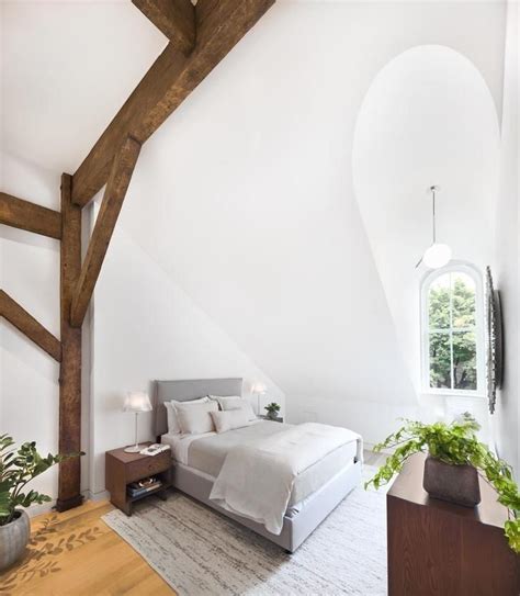 A true vaulted ceiling generally depicts different wall heights on either side of the sloping ceiling, in contrast with a cathedral ceiling, which usually has without the romantic low lighting hidden in the indent…makes no sense in a bedroom. Attic bedroom under a vaulted ceiling with exposed beams ...