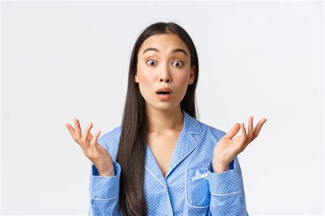 Free Photo Close Up Of Confused And Shocked Asian Girl In Blue Pajama